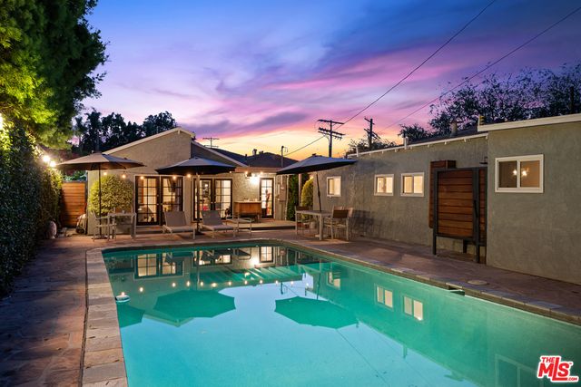 a view of a swimming pool with a patio
