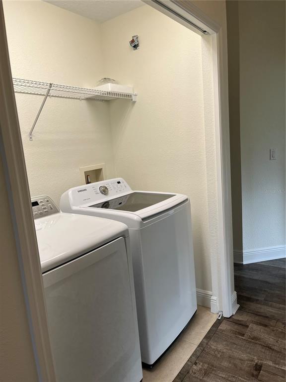 200 Riverview Bend South, Unit 921 Palm Coast, FL 32137 - Photo 19 of 27 a utility room with dryer and washer