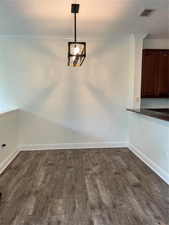 200 Riverview Bend South, Unit 921 Palm Coast, FL 32137 - Photo 8 of 27 a view of a room with a sink wooden floor and a ceiling fan