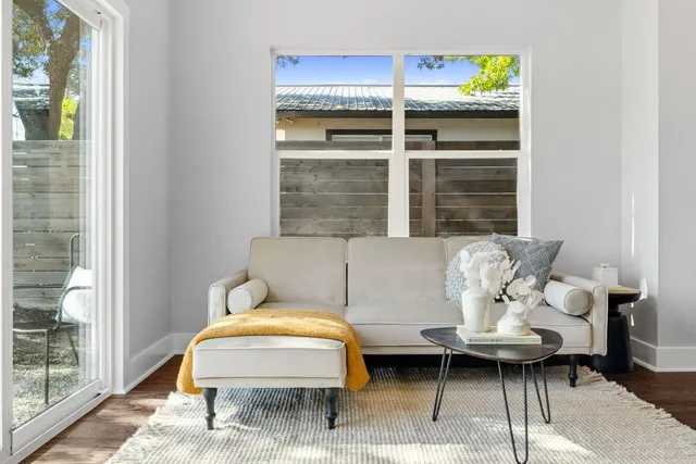 a living room with furniture and a window