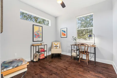 a view of a livingroom with furniture and windows