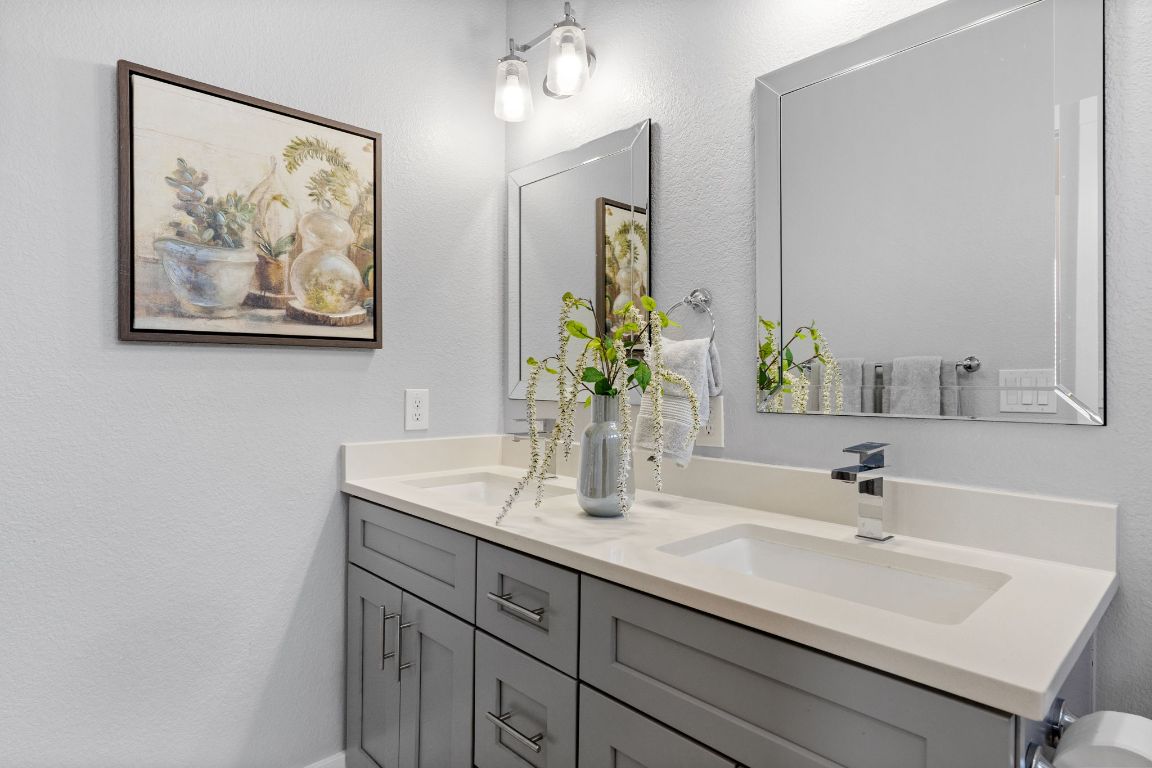 304 Blackson Avenue, Unit A Austin, TX 78752 - Photo 19 of 26 a bathroom with a sink and a mirror