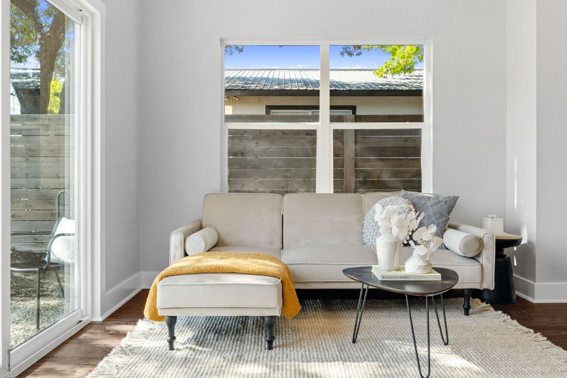 304 Blackson Avenue, Unit A Austin, TX 78752 - Photo 5 of 26 a living room with furniture and a window