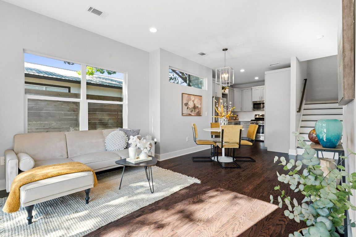 304 Blackson Avenue, Unit A Austin, TX 78752 - Photo 6 of 26 a living room with furniture and a large window