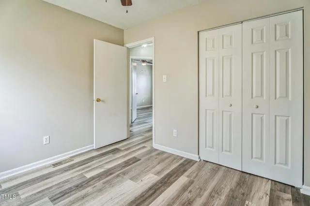 a view of a livingroom with wooden floor