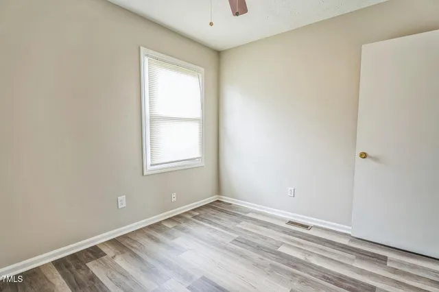 a view of a room with a window and cabinet