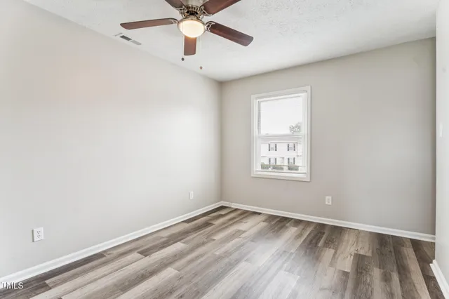a view of a wooden door with a house
