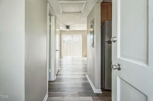 a view of a bathroom from the hallway