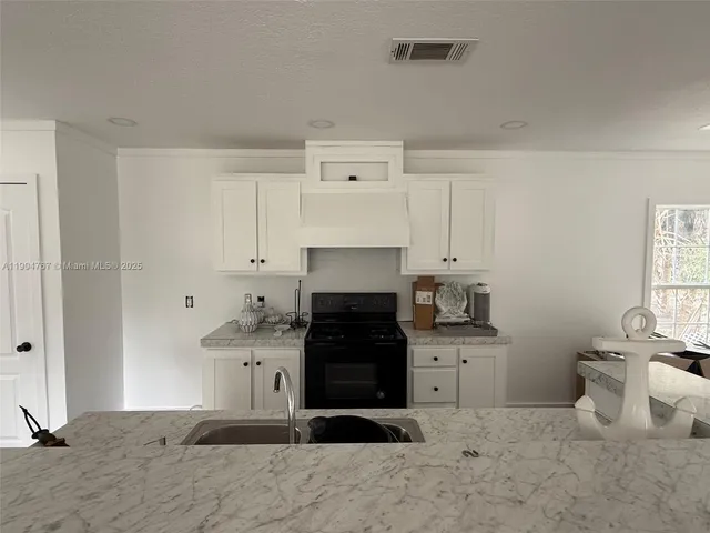 a kitchen with a stove and a refrigerator