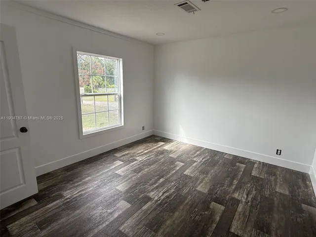 an empty room with windows