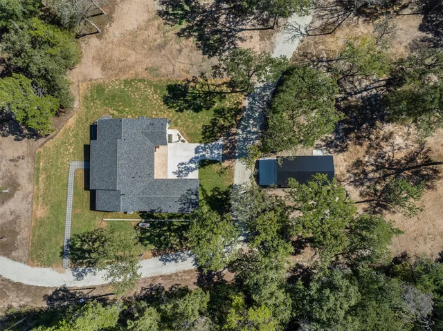 a view of a lake in middle of forest