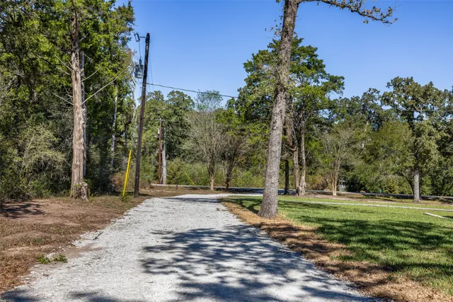 a backyard of a house with lots of green space