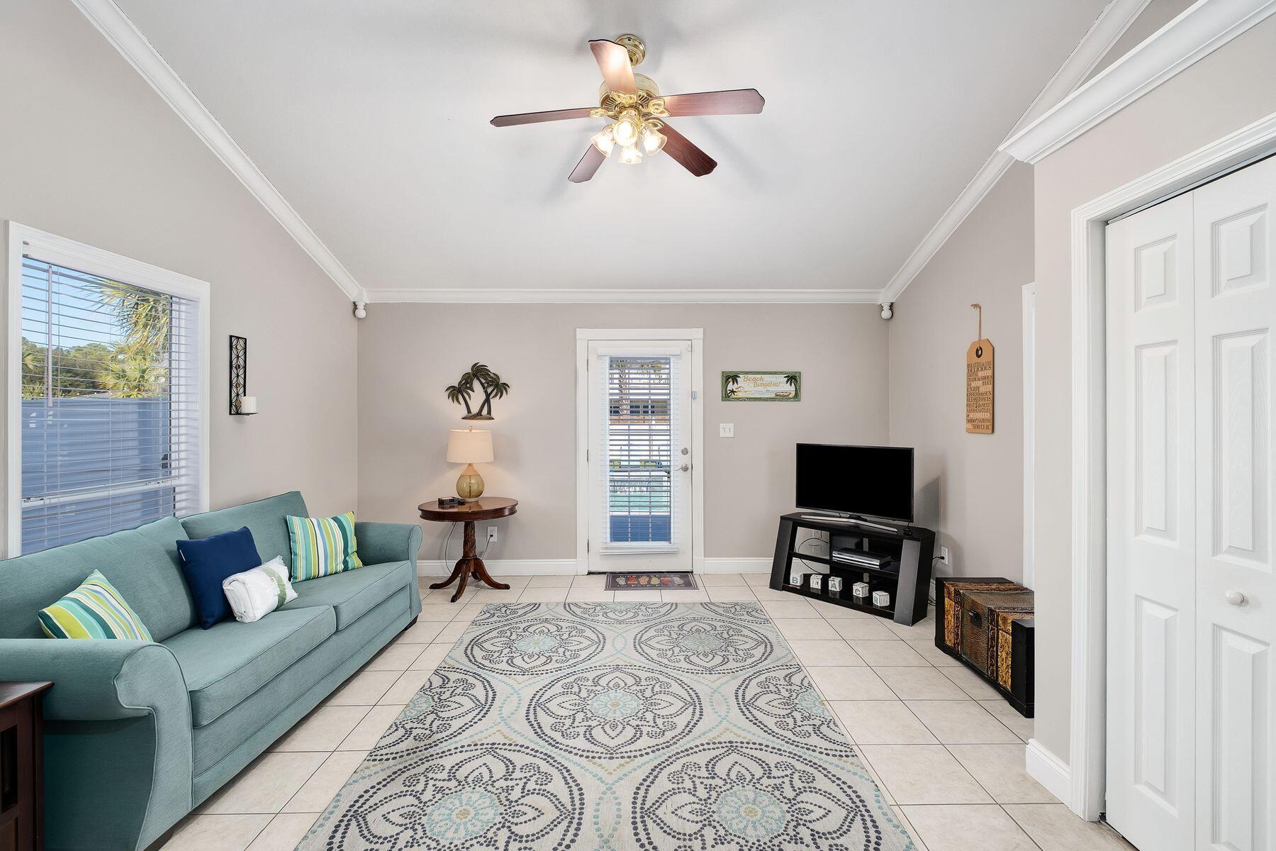 172 Sugar Sand Lane Santa Rosa Beach, FL 32459 - Photo 16 of 40 a living room with furniture and a flat screen tv