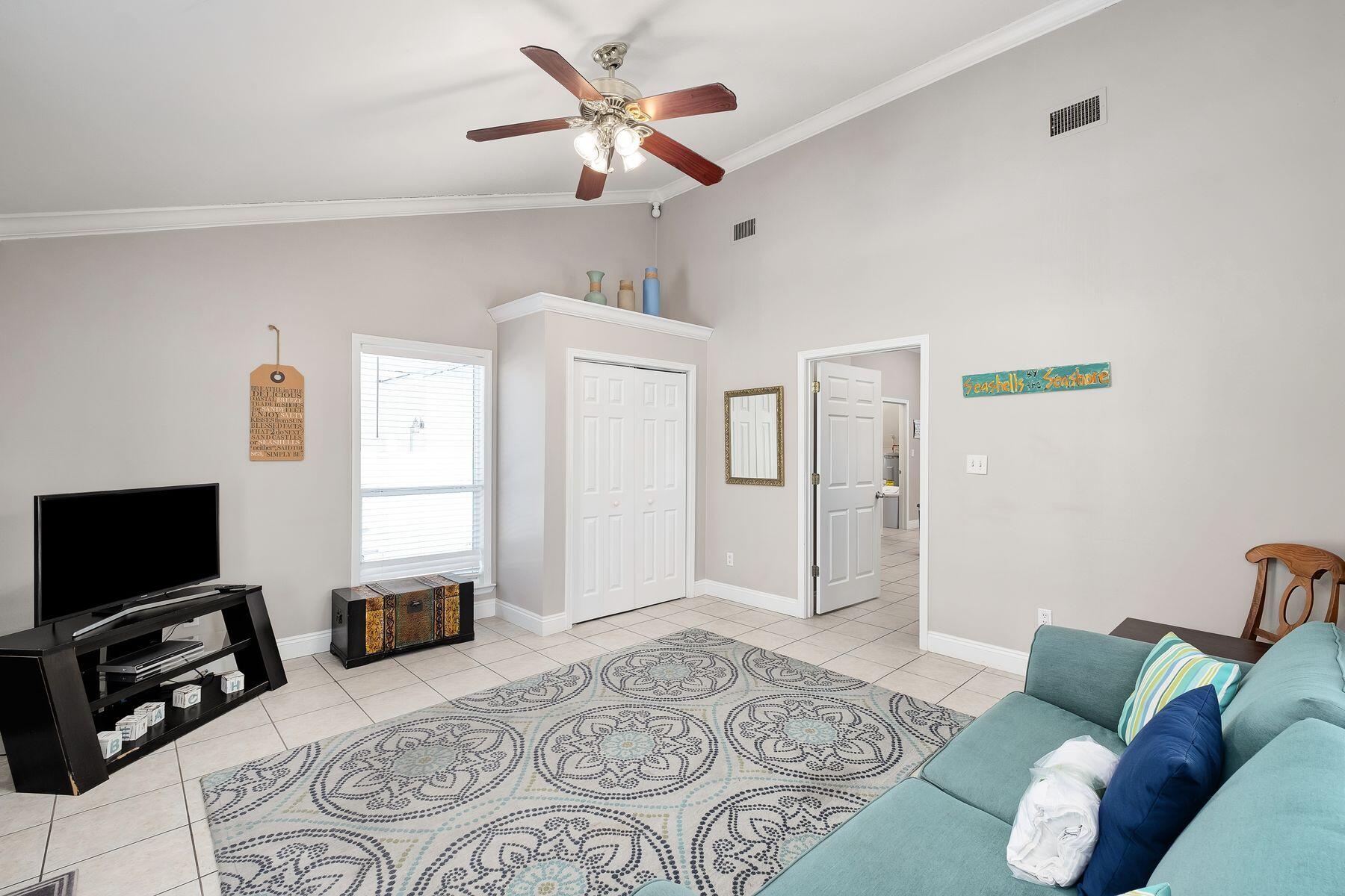 172 Sugar Sand Lane Santa Rosa Beach, FL 32459 - Photo 17 of 40 a living room with furniture and a flat screen tv