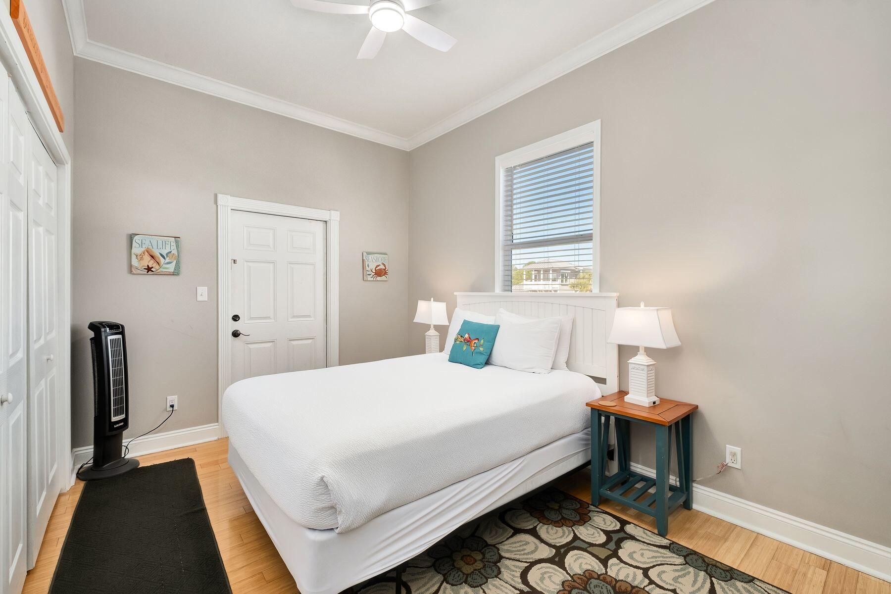 172 Sugar Sand Lane Santa Rosa Beach, FL 32459 - Photo 21 of 40 a bedroom with a bed and a table