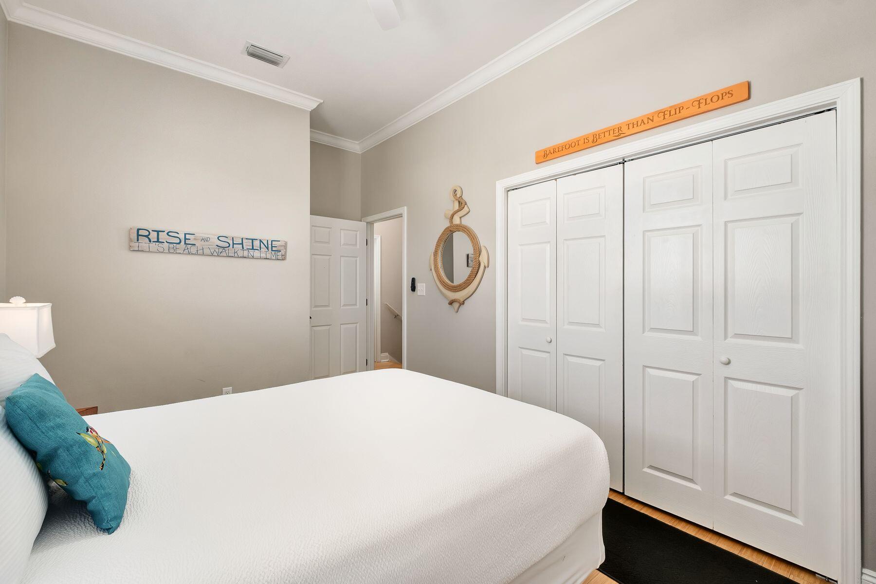 172 Sugar Sand Lane Santa Rosa Beach, FL 32459 - Photo 22 of 40 a bedroom with a bed and a closet