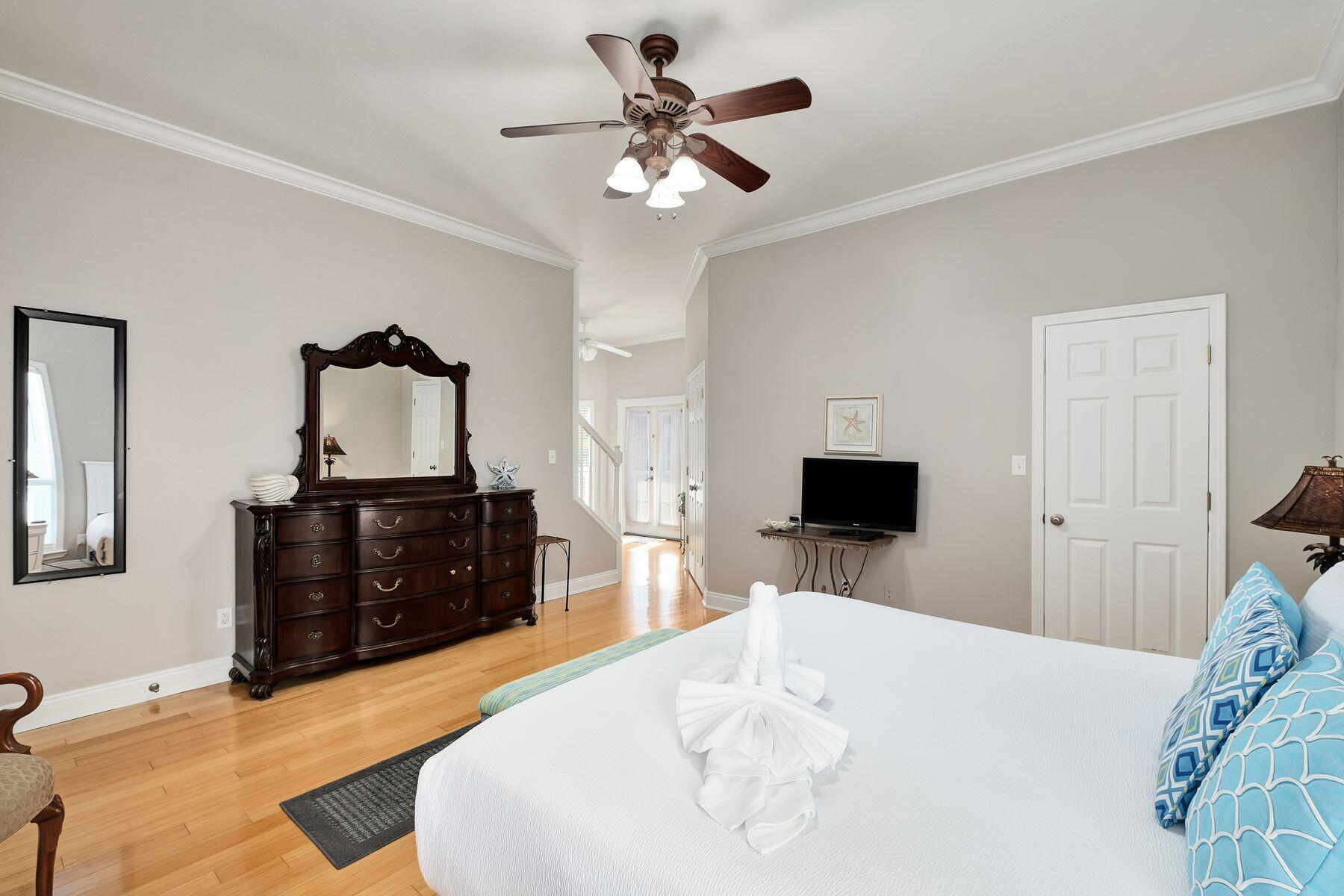 172 Sugar Sand Lane Santa Rosa Beach, FL 32459 - Photo 25 of 40 a bedroom with a bed and a flat screen tv