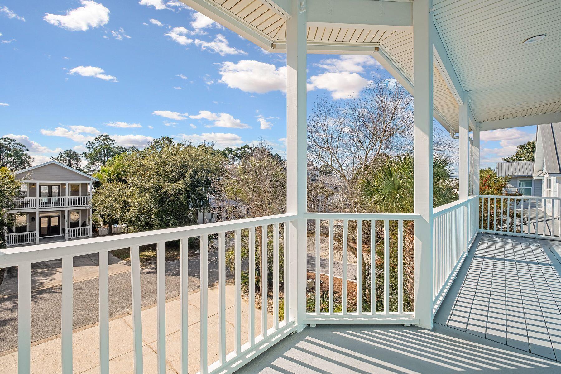 172 Sugar Sand Lane Santa Rosa Beach, FL 32459 - Photo 26 of 40 a view of a balcony with wooden floor