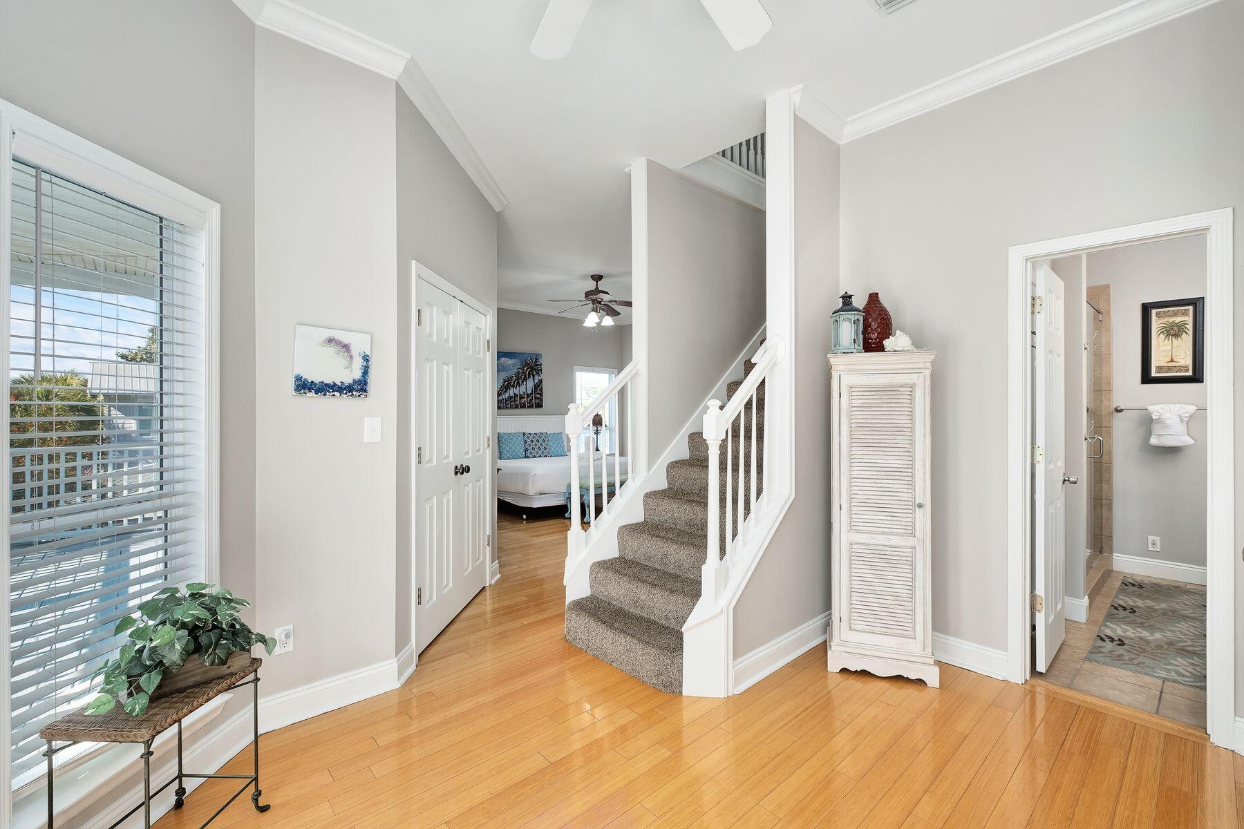 172 Sugar Sand Lane Santa Rosa Beach, FL 32459 - Photo 28 of 40 a view of an entryway with wooden floor and a livingroom view