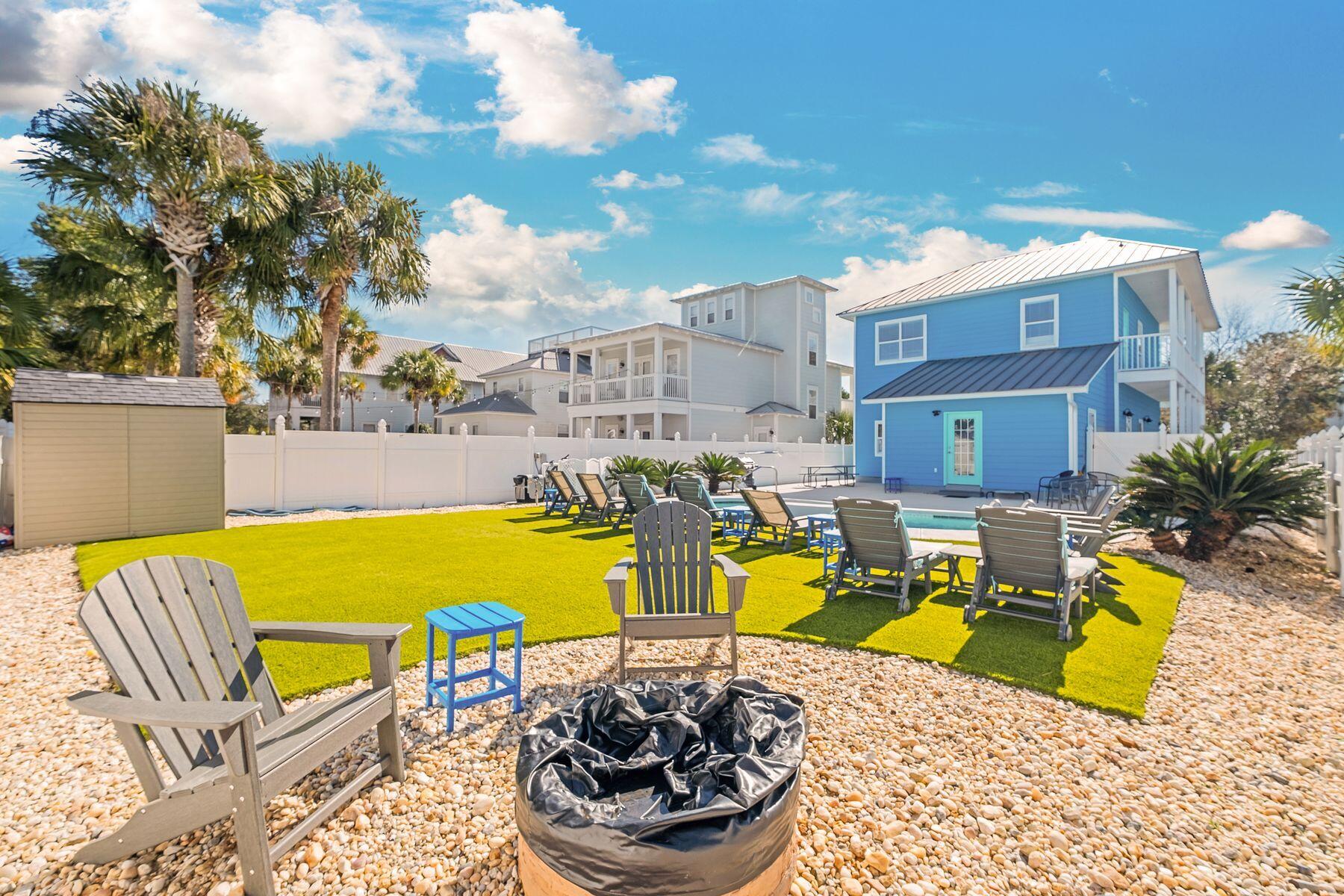 172 Sugar Sand Lane Santa Rosa Beach, FL 32459 - Photo 37 of 40 a view of a swimming pool with a lounge chairs