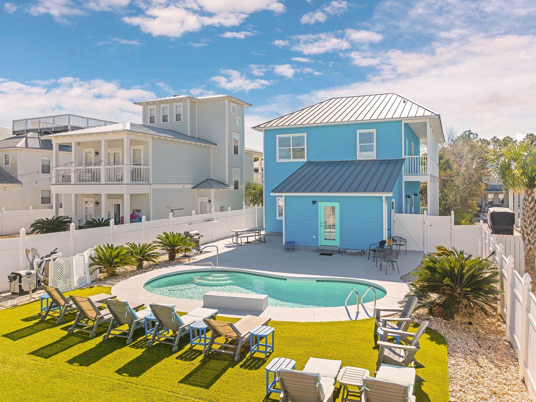 172 Sugar Sand Lane Santa Rosa Beach, FL 32459 - Photo 38 of 40 a view of a house with backyard and swimming pool