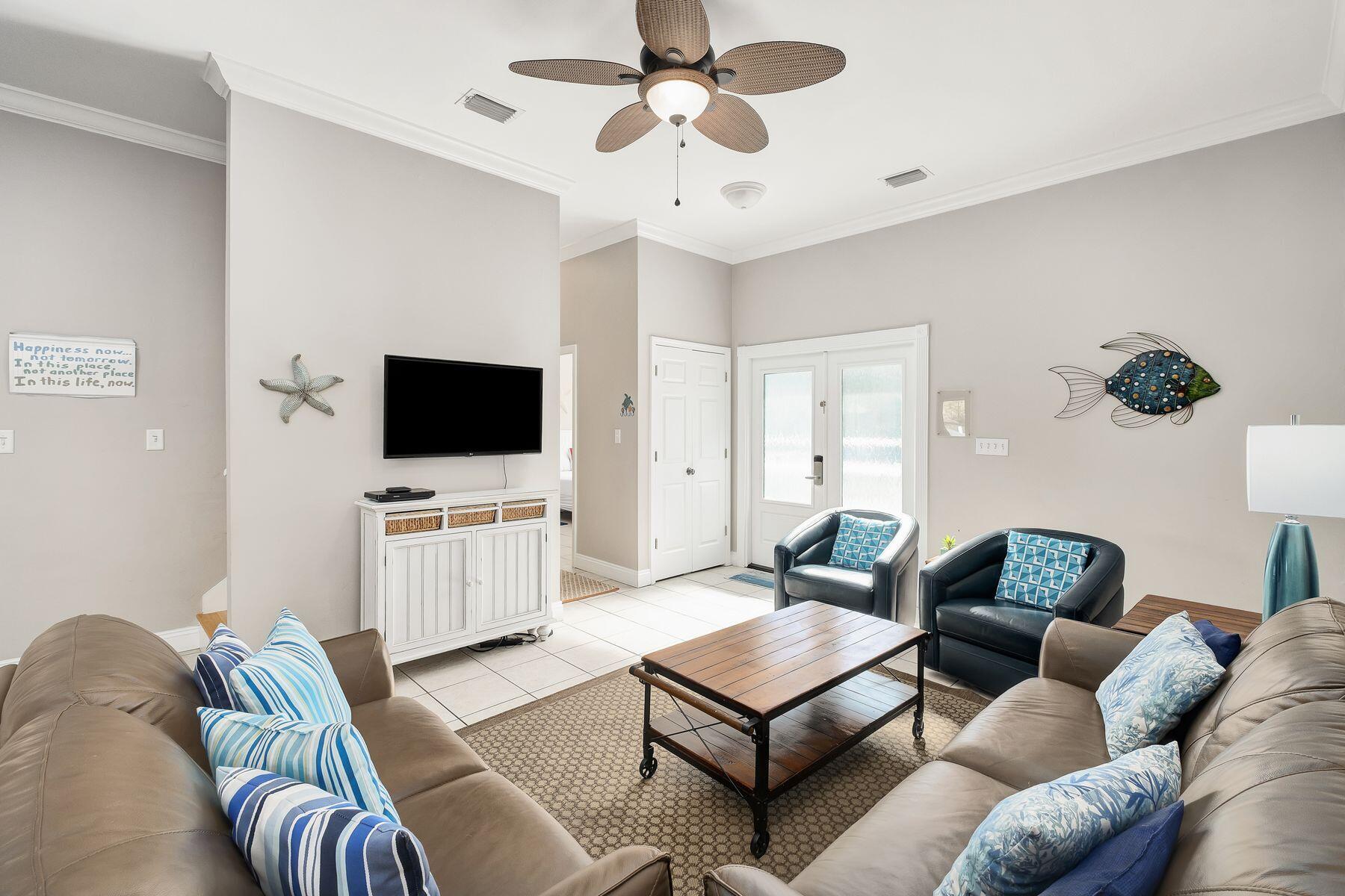 172 Sugar Sand Lane Santa Rosa Beach, FL 32459 - Photo 4 of 40 a living room with furniture and a flat screen tv