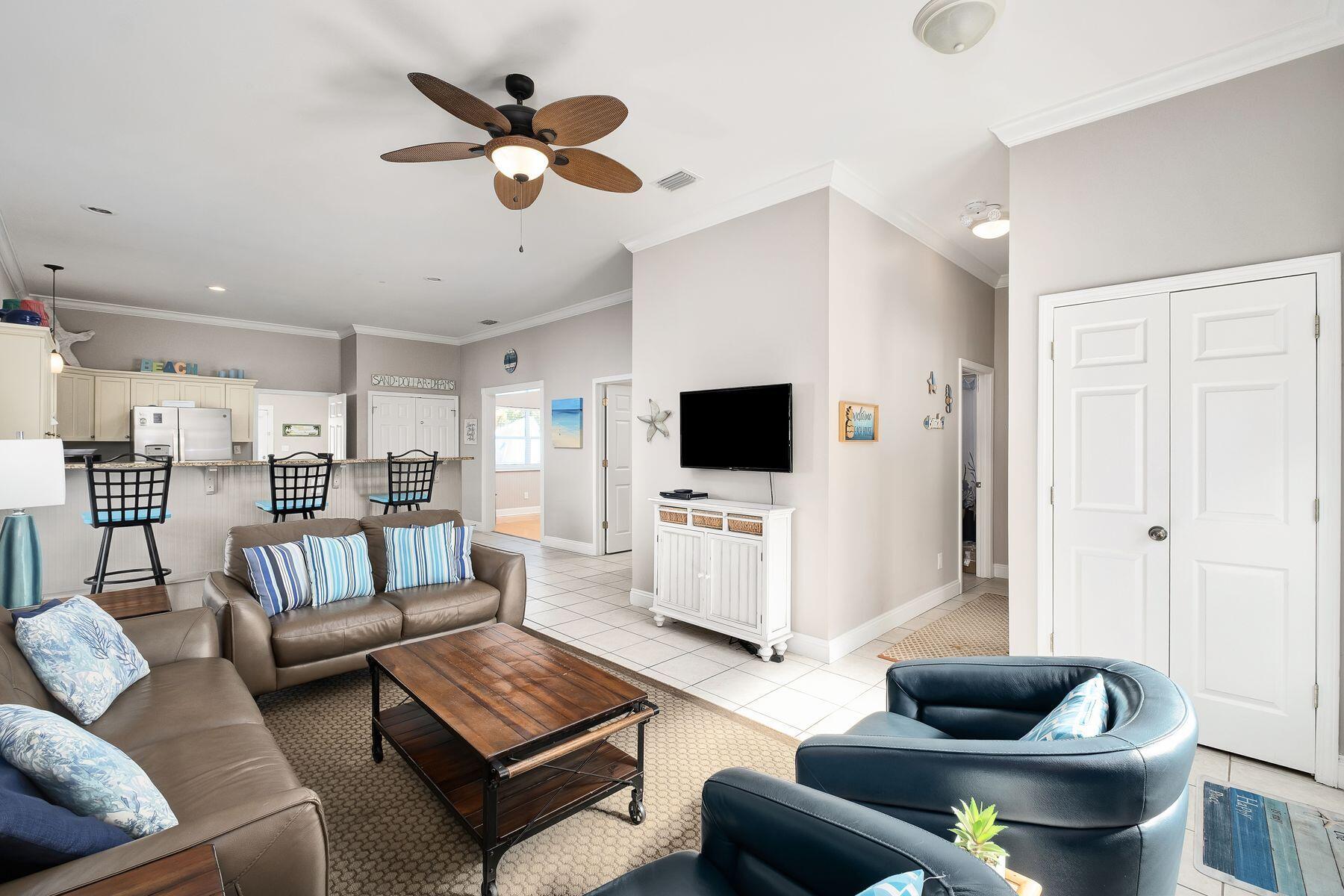 172 Sugar Sand Lane Santa Rosa Beach, FL 32459 - Photo 6 of 40 a living room with furniture and a flat screen tv