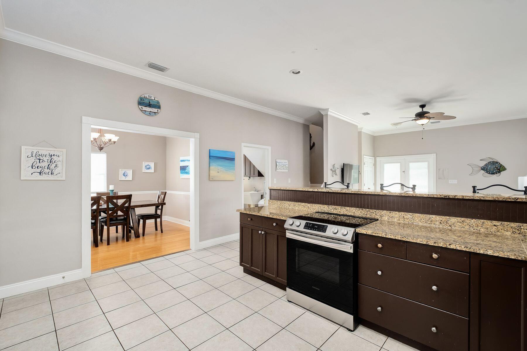 172 Sugar Sand Lane Santa Rosa Beach, FL 32459 - Photo 10 of 40 a kitchen with stainless steel appliances granite countertop a stove a sink and a refrigerator
