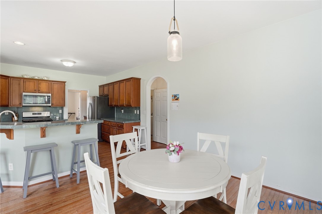 5305 Wellington Ridge Road Richmond, VA 23231 - Photo 22 of 67 Dining area featuring wood-finish flooring and a c