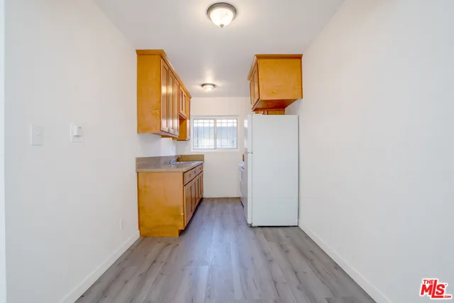 a room with a sink and a mirror