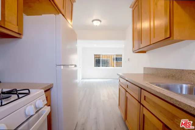 a kitchen that has a sink and a stove
