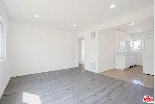 a view of a kitchen with wooden floor