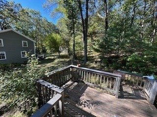 38 Cedar Street, Unit 1 Holliston, MA 01746 - Photo 2 of 15 a view of balcony with wooden floor and outdoor seating