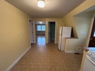38 Cedar Street, Unit 1 Holliston, MA 01746 - Photo 6 of 15 a view of a storage & utility room with a sink