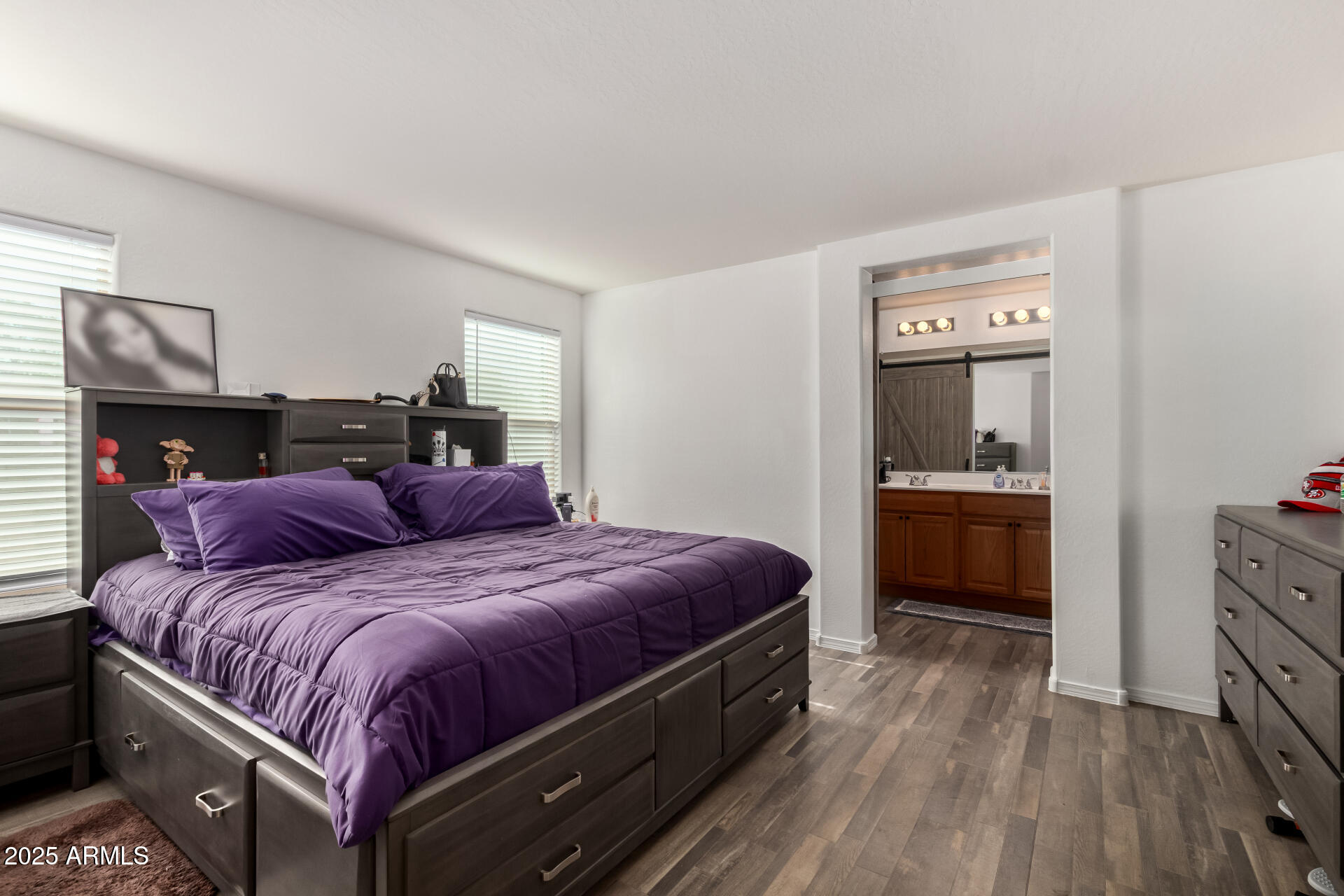 910 Prior Avenue Coolidge, AZ 85128 - Photo 9 of 22 a bedroom with a bed and a view of kitchen