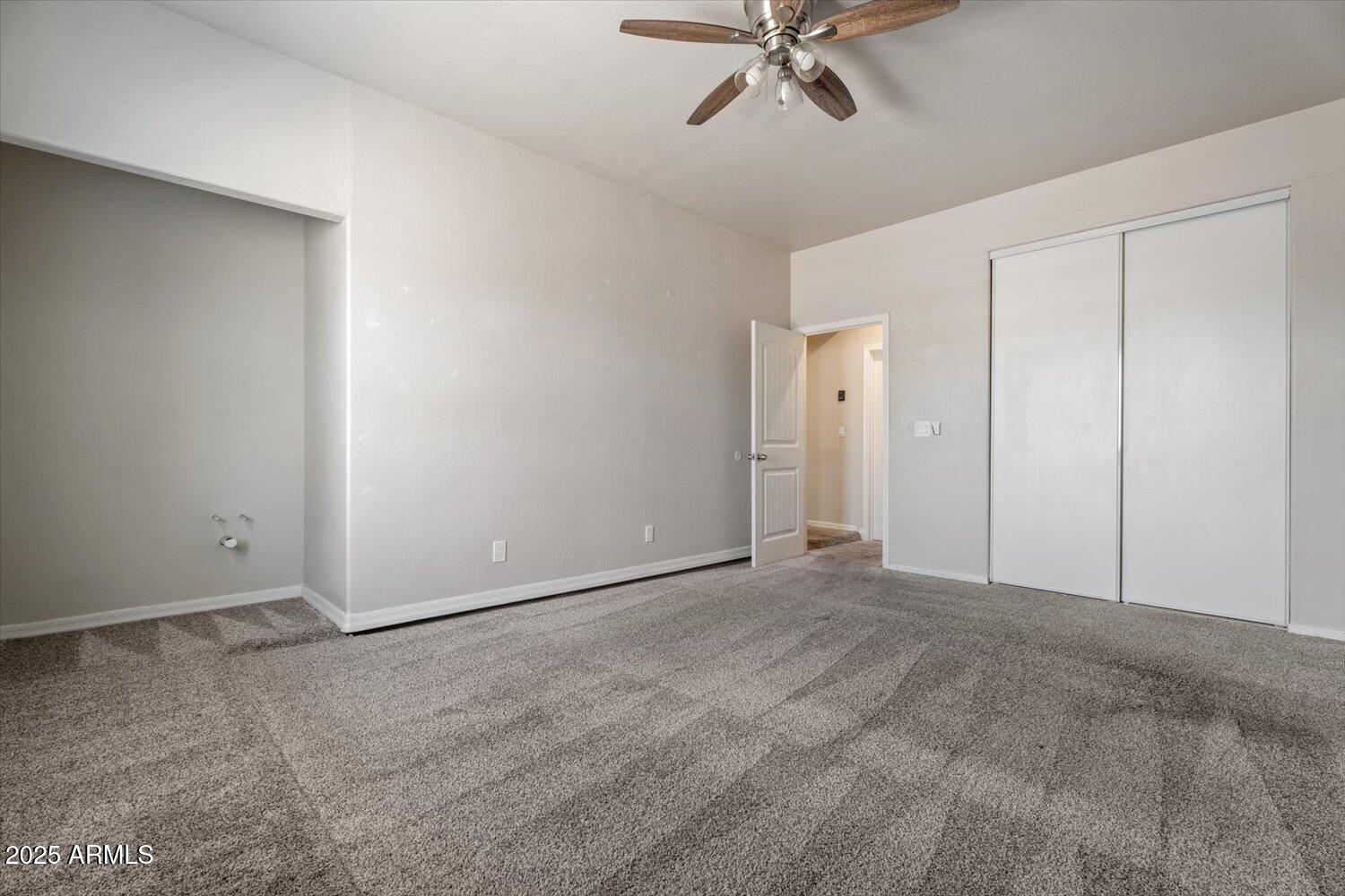 1423 South Newberry Lane Tempe, AZ 85281 - Photo 8 of 19 a view of an empty room with a fan