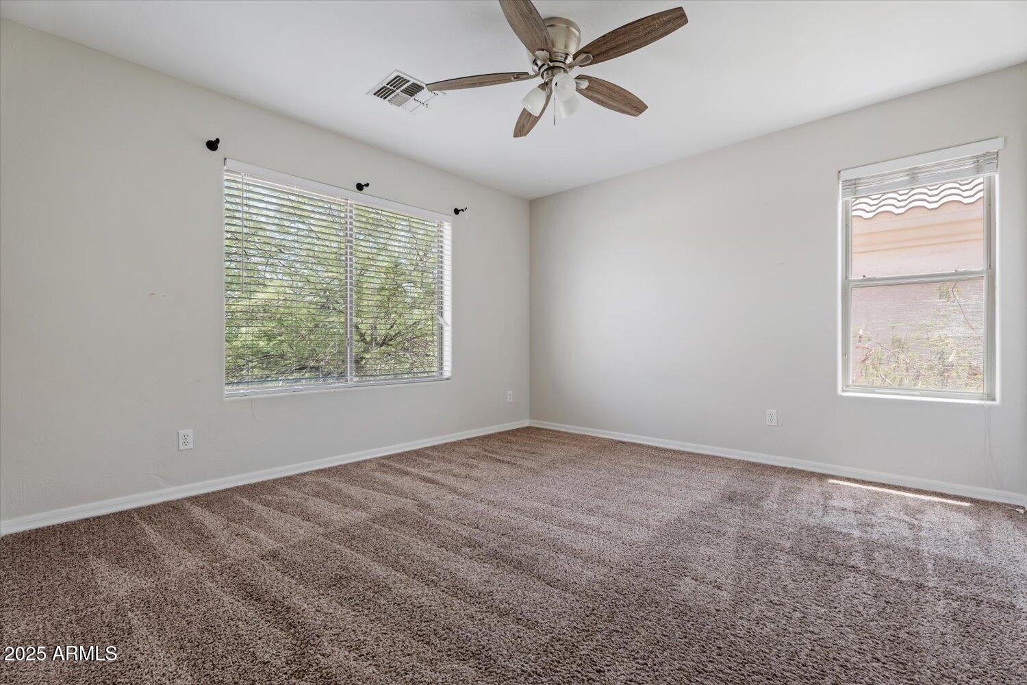 1423 South Newberry Lane Tempe, AZ 85281 - Photo 10 of 19 a view of an empty room with a window