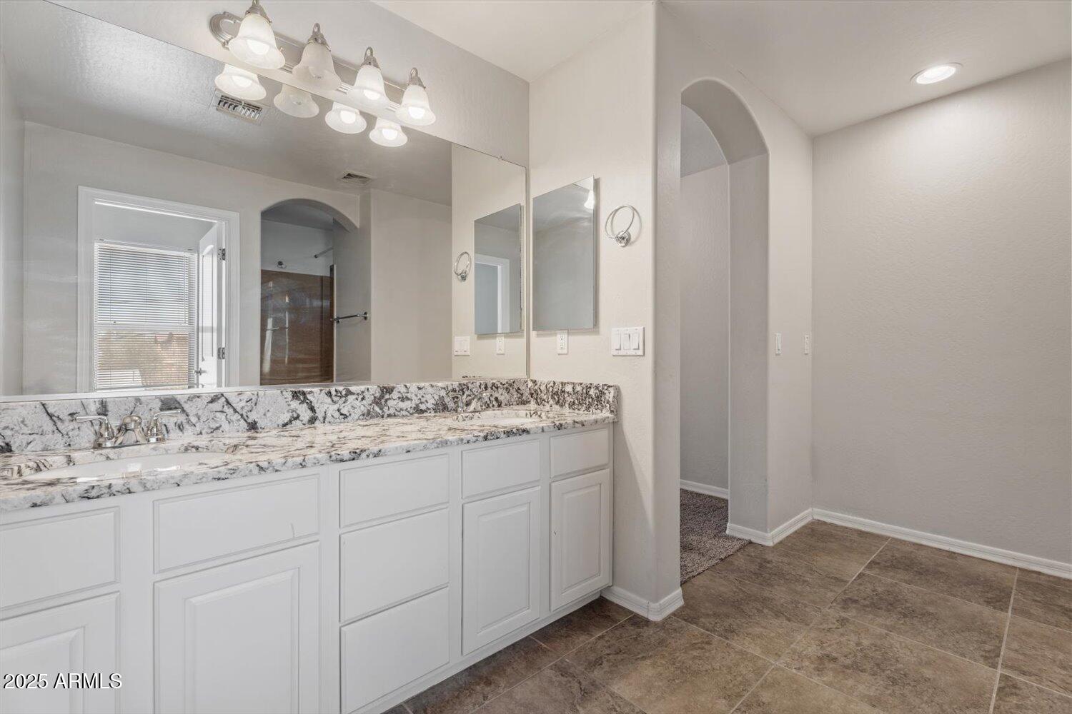 1423 South Newberry Lane Tempe, AZ 85281 - Photo 13 of 19 a bathroom with a sink and a mirror