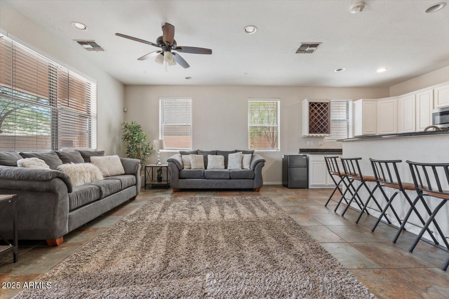 1423 South Newberry Lane Tempe, AZ 85281 - Photo 7 of 19 a living room with furniture and a large window