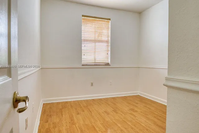 a view of a bathroom with a shower curtain