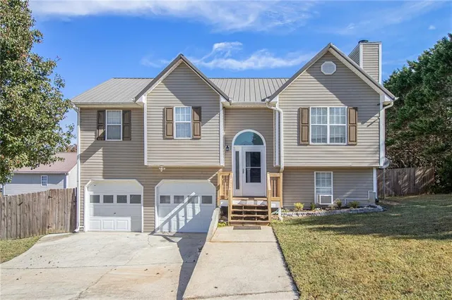a front view of a house with a yard