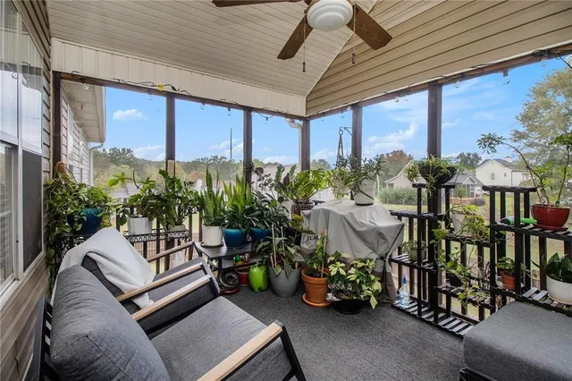 a outdoor living space with furniture and a potted plant