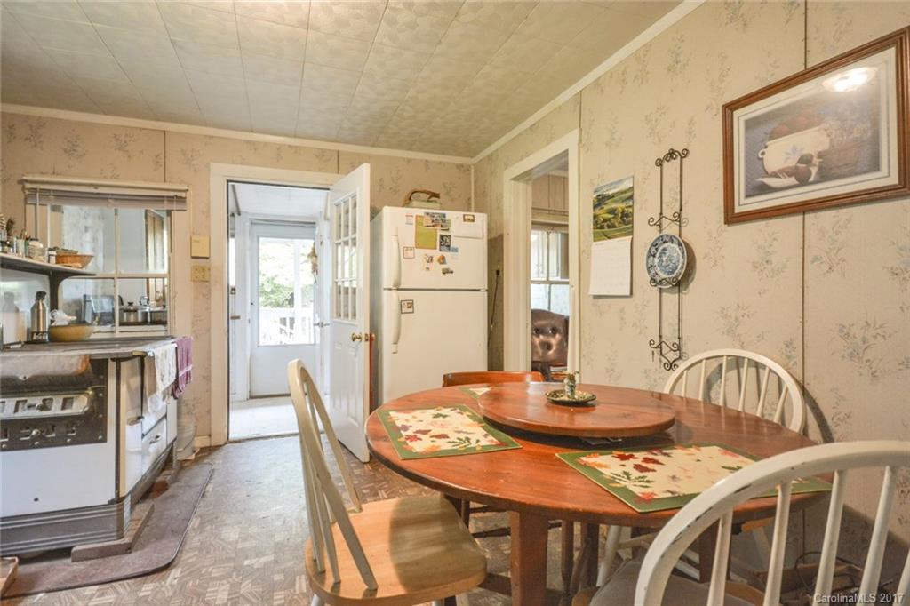 7300 Little Pine Road Marshall, NC 28753 - Photo 22 of 24 a view of a dining room with furniture and wooden floor