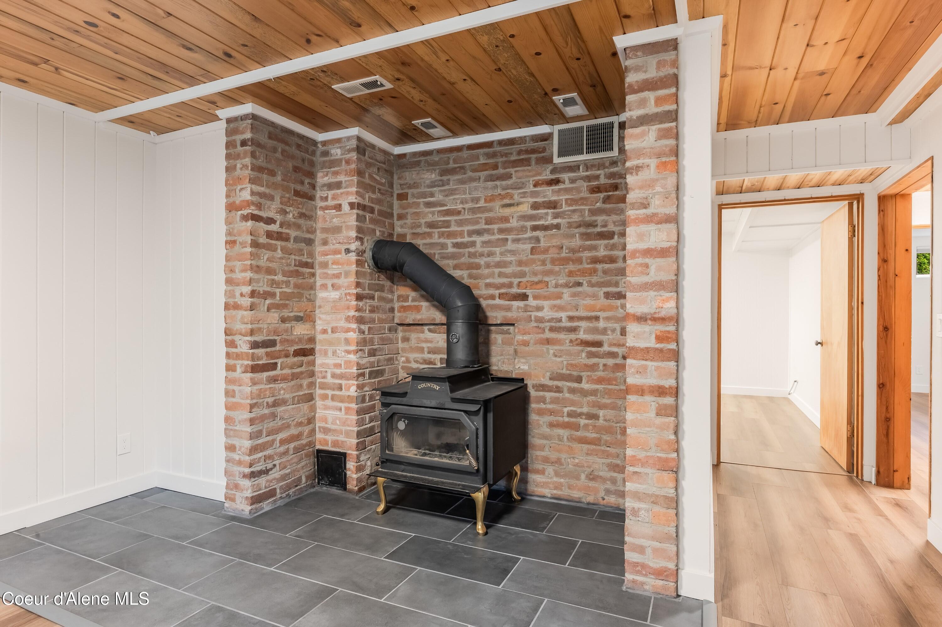 1143 East Rookery Road Hayden, ID 83835 - Photo 29 of 67 Downstairs Wood-Burning Stove