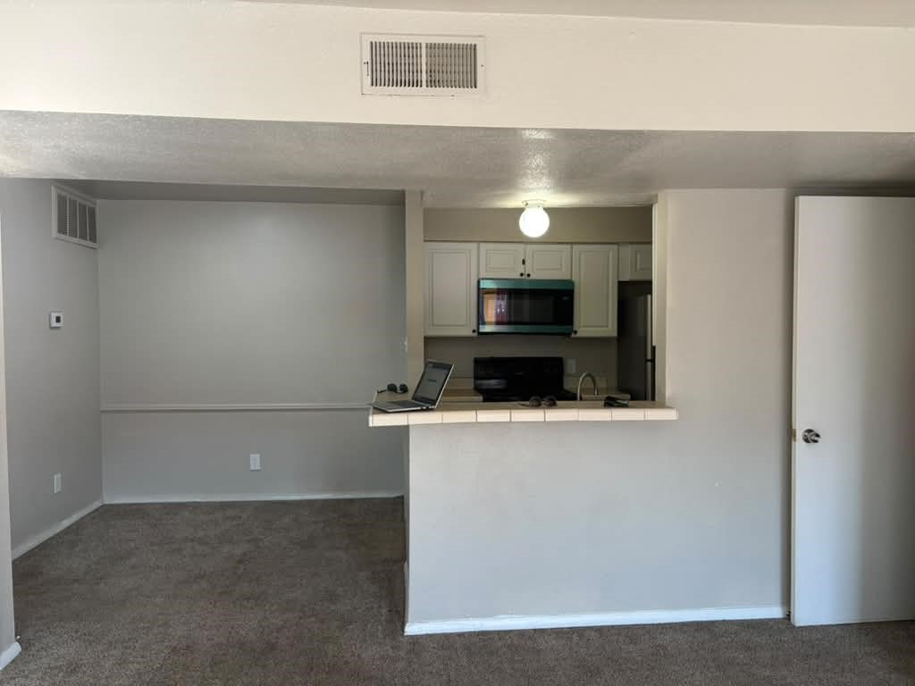 Dining Area Next to Kitchen. New light Fixtures in place.