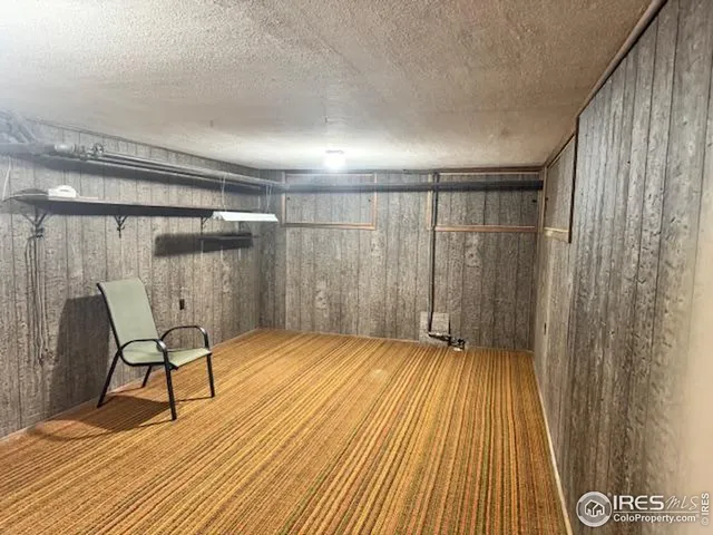 a view of a room with wooden floor and chair