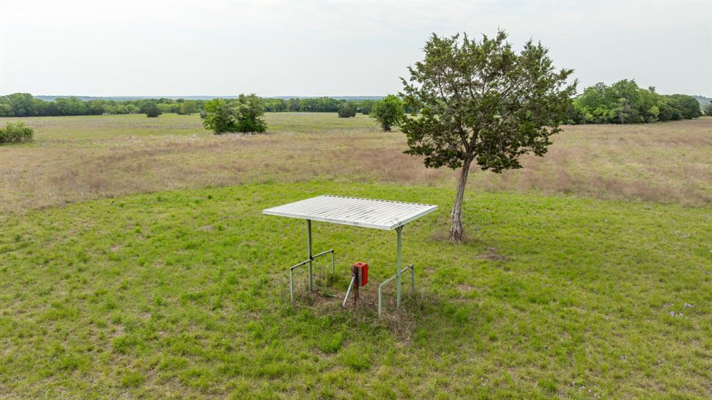 281 North East Hamilton, TX 76531 - Photo 7 of 11 a view of a lake with a table and chairs