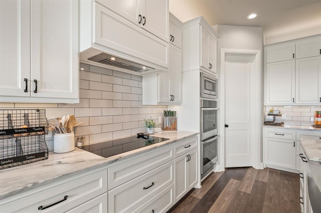 175 County Road 1109 Decatur, TX 76234 - Photo 12 of 39 a kitchen with a sink and cabinets
