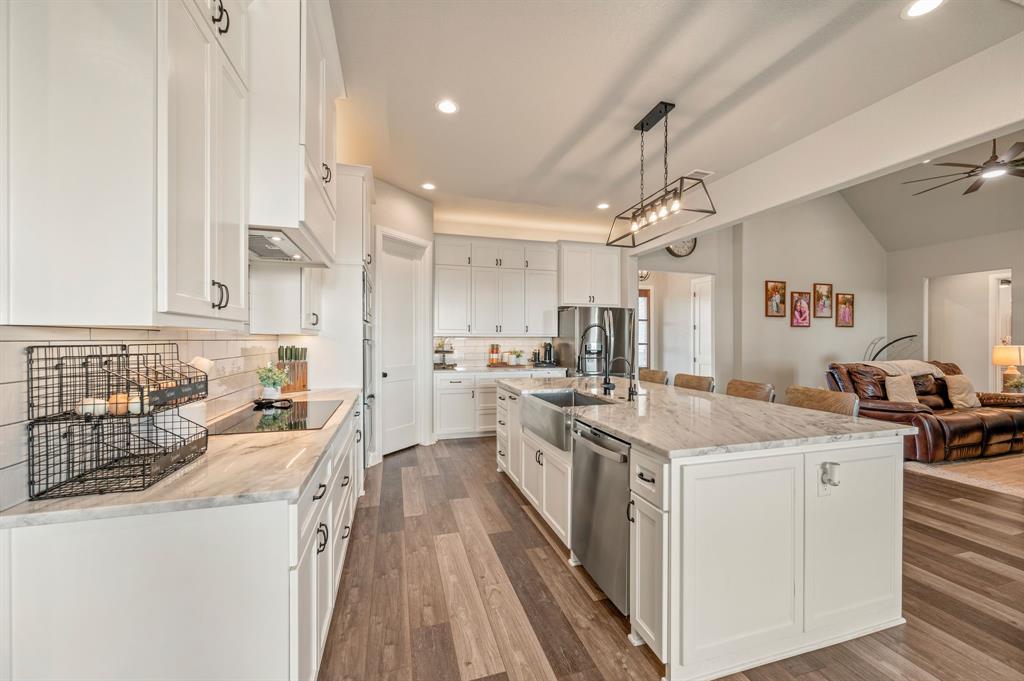 175 County Road 1109 Decatur, TX 76234 - Photo 13 of 39 a kitchen with a sink stove and cabinets