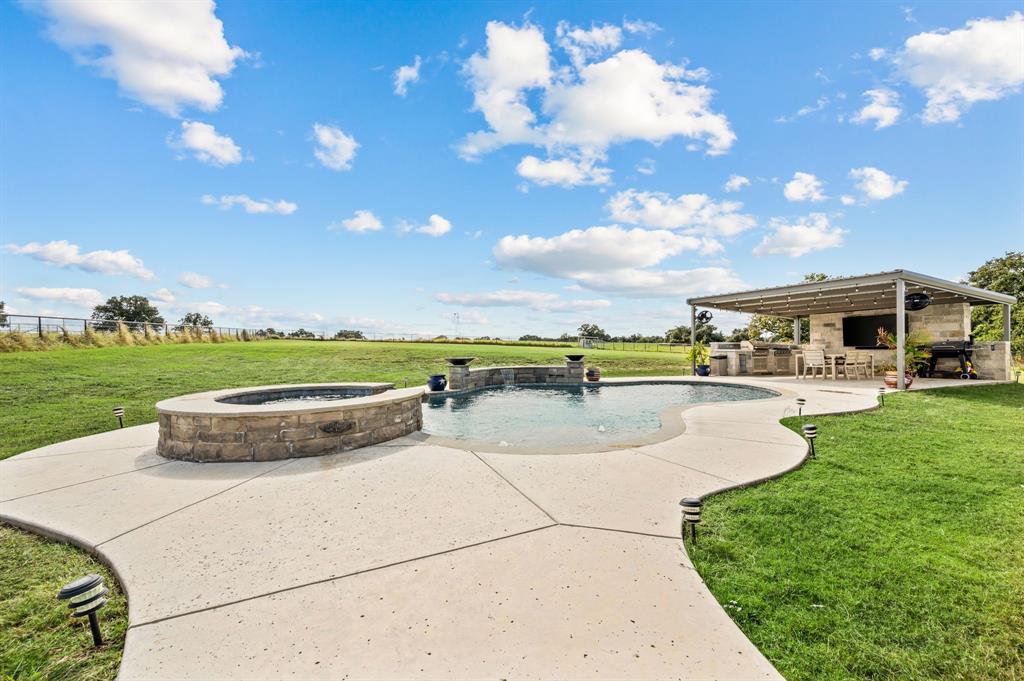 175 County Road 1109 Decatur, TX 76234 - Photo 2 of 39 a view of a swimming pool and a yard